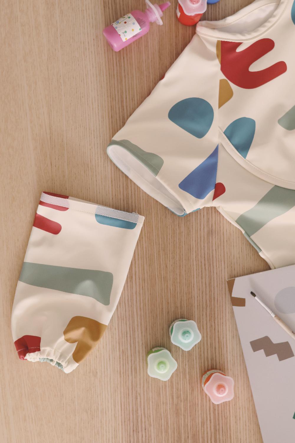 babymarkt Lätzchen 2-in1 mit abnehmbaren Ärmeln Im Verkauf
